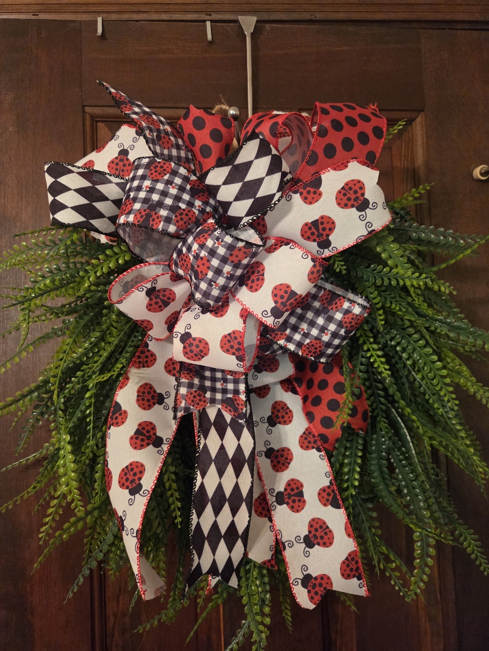 Source Unknown Red and Black Ladybug Ribbon Holiday Wreath with Greenery
